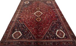 Surface texture of 2000s Shiraz rug with natural Wool and intricate pattern