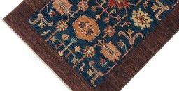 Backside of handmade New Farahan rug showing knot structure and weave density