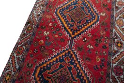 Backside of handmade 2000s Shiraz rug showing knot structure and weave density