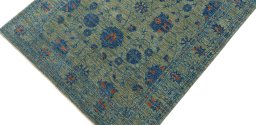 Backside of handmade New Farahan rug showing knot structure and weave density