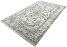 Corner detail of 2000s Nain rug showing border pattern and Wool pile