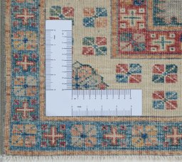 Corner detail of New Kazak rug showing border pattern and Wool pile