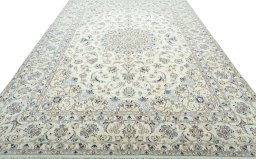 Surface texture of 2000s Nain rug with natural Wool and intricate pattern