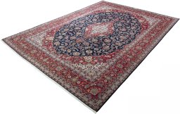 Corner detail of 2000s Kashan rug showing border pattern and Cork pile