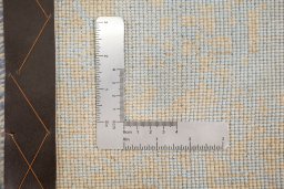 Corner detail of New Organic rug showing border pattern and Wool pile