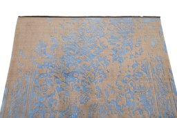Backside of handmade New Organic rug showing knot structure and weave density