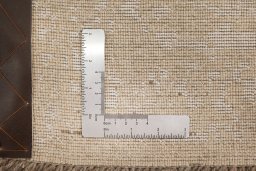 Corner detail of New Organic rug showing border pattern and Wool pile