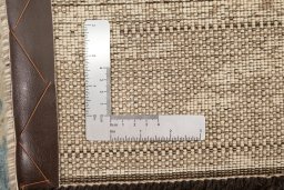 Corner detail of New Organic rug showing border pattern and Wool pile