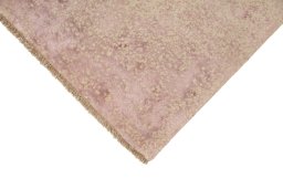 Backside of handmade New Organic rug showing knot structure and weave density