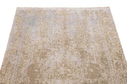Backside of handmade New Organic rug showing knot structure and weave density