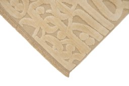 Backside of handmade New Organic rug showing knot structure and weave density