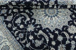 Close-up detail of New Nain rug from Iran / Persia showing Wool weave
