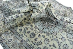 Surface texture of 2000s Nain rug with natural Wool and intricate pattern