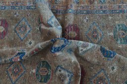 Full view of New Kazak rug from Pakistan, 304 × 244 cm in Yellow tones