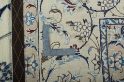Backside of handmade 2000s Nain rug showing knot structure and weave density