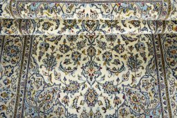 Close-up detail of 2000s Kashan rug from Iran / Persia showing Wool weave
