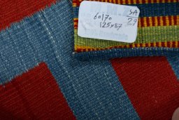 Corner detail of New Kilim Sofre rug showing border pattern and Wool pile
