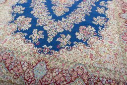 Close-up detail of 1970s Kerman rug from Iran / Persia showing Wool weave