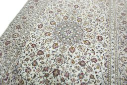Backside of handmade 2000s Kashan rug showing knot structure and weave density