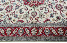 Corner detail of 2000s Sarough rug showing border pattern and Wool pile