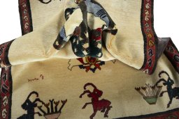Corner detail of 2000s Persian Gabbeh rug showing border pattern and Wool pile