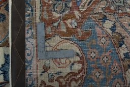 Backside of handmade 2000s Kashmar rug showing knot structure and weave density