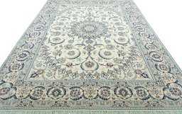 Surface texture of 2000s Nain rug with natural Wool and intricate pattern