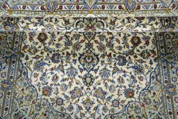 Surface texture of 2000s Kashan rug with natural Cork and intricate pattern