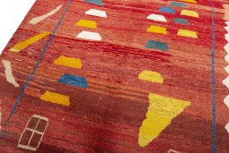 Backside of handmade 2000s Persian Gabbeh rug showing knot structure and weave density