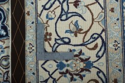 Backside of handmade 2000s Nain rug showing knot structure and weave density