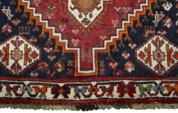 Close-up detail of 2000s Shiraz rug from Iran / Persia showing Wool weave