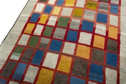 Backside of handmade 2000s Persian Gabbeh rug showing knot structure and weave density