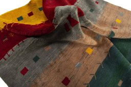 Corner detail of 2000s Persian Gabbeh rug showing border pattern and Wool pile