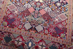 Close-up detail of 2000s Kashan rug from Iran / Persia showing Wool weave