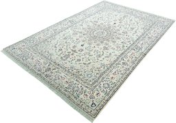 Corner detail of 2000s Nain rug showing border pattern and Wool pile