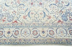 Corner detail of 2000s Nain rug showing border pattern and Wool pile