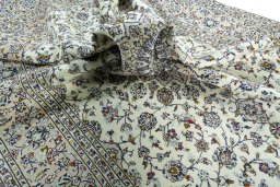 Surface texture of 2000s Kashan rug with natural Wool and intricate pattern