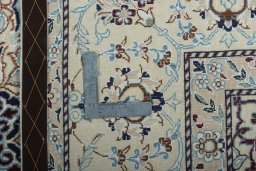 Backside of handmade 2000s Nain rug showing knot structure and weave density