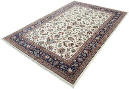 Corner detail of 2000s Mashad rug showing border pattern and Wool pile