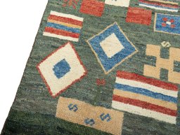 Backside of handmade 2000s Persian Gabbeh rug showing knot structure and weave density