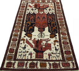 Surface texture of 1930s Baloch rug with natural Wool and intricate pattern