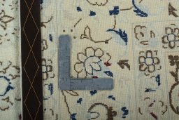Backside of handmade 2000s Nain rug showing knot structure and weave density