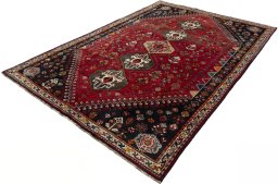 Corner detail of 2000s Shiraz rug showing border pattern and Wool pile