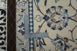 Backside of handmade New Nain rug showing knot structure and weave density