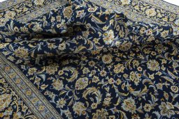Surface texture of 2000s Kashan rug with natural Wool and intricate pattern