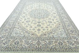 Surface texture of 2000s Nain rug with natural Wool and intricate pattern