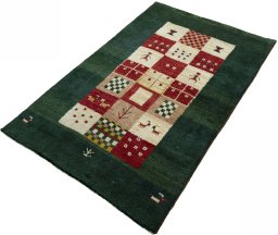 Corner detail of 2000s Persian Gabbeh rug showing border pattern and Wool pile