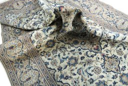 Surface texture of 2000s Kashan rug with natural Wool and intricate pattern