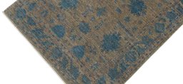 Backside of handmade New Farahan rug showing knot structure and weave density