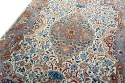 Backside of handmade 2000s Kashmar rug showing knot structure and weave density